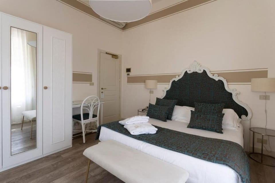 Double or Twin Room, Balcony, Partial Sea View | Minibar, in-room safe, iron/ironing board, cribs/infant beds