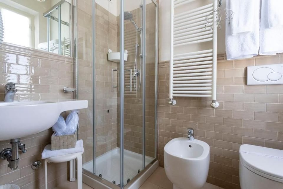 Double or Twin Room, Balcony, Partial Sea View | Bathroom | Shower, hair dryer, bathrobes, slippers