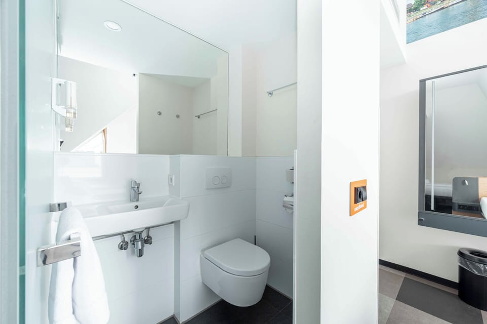 Shower, eco-friendly toiletries, hair dryer, towels