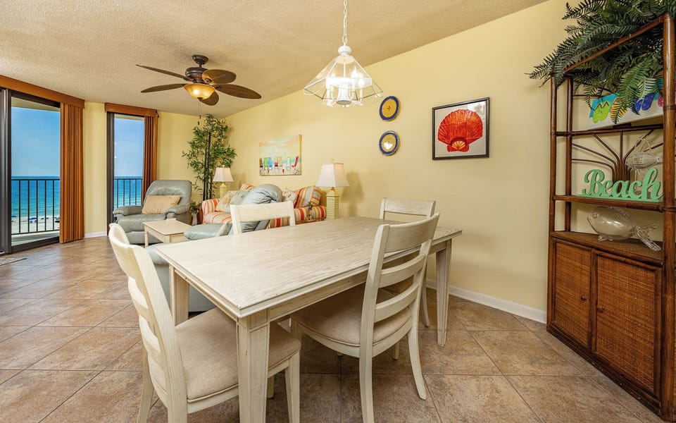 Meals feel easy as you gather at the dining table with a beachfront view