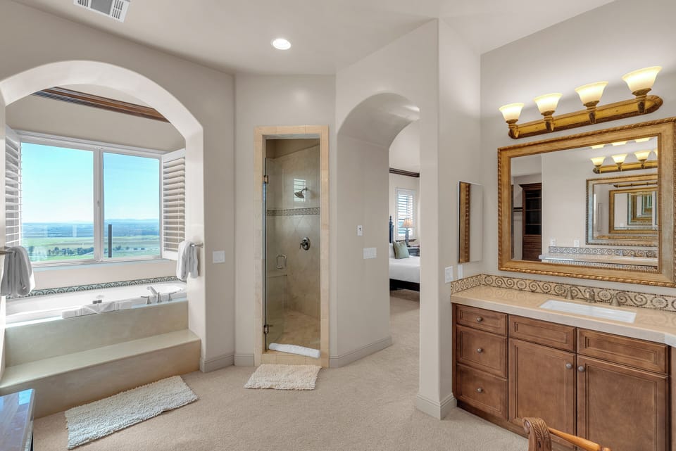 Unwind in the soaking tub with scenic valley views