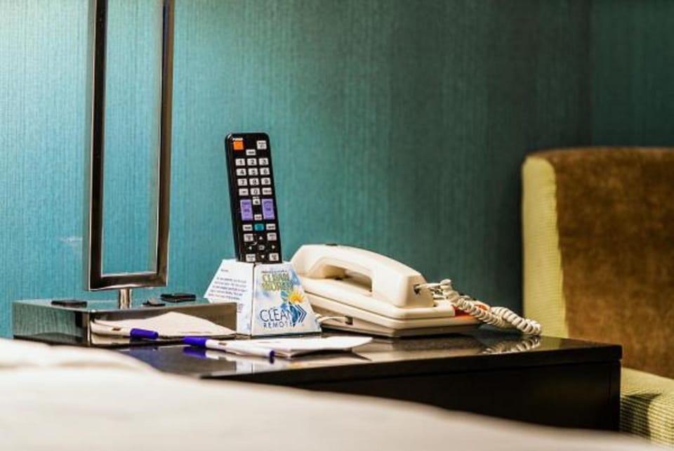 Desk, laptop workspace, blackout drapes, iron/ironing board