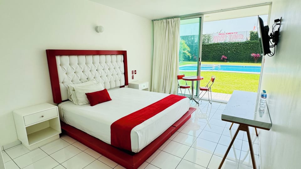 Deluxe Room, 1 King Bed, Air conditioning, Pool View | Egyptian cotton sheets, premium bedding, down comforters