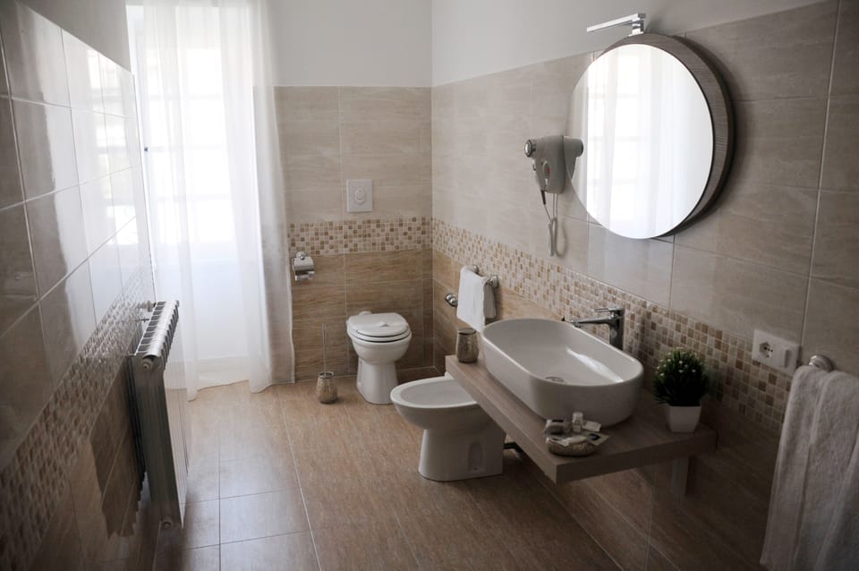 Family Room | Bathroom | Hair dryer, bathrobes, slippers, bidet