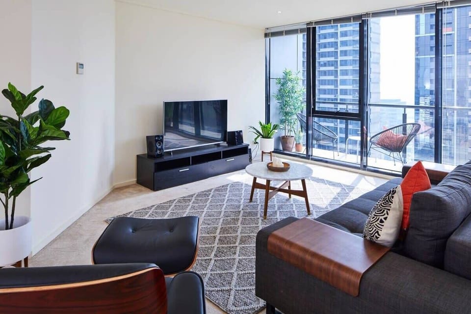 Floor to ceiling windows which open out onto private balcony