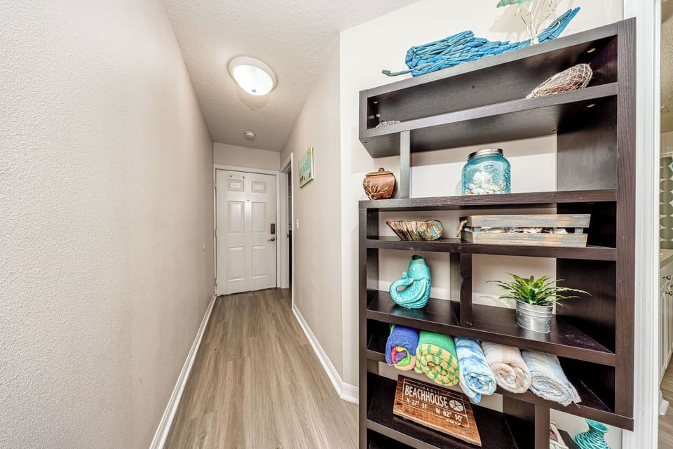 Interiors are warm and inviting. Unit includes beach towels.