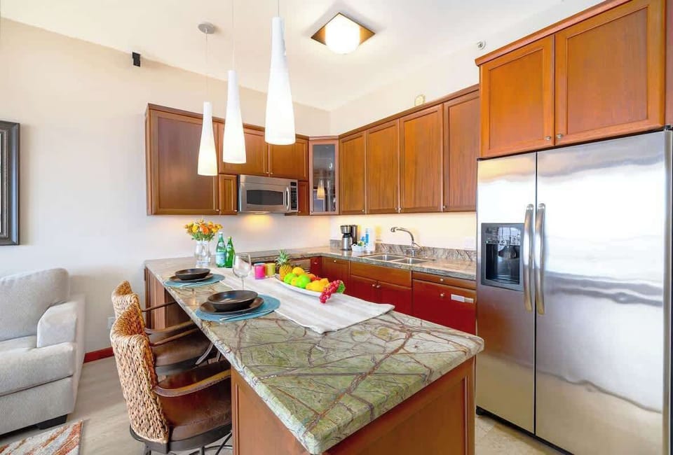 Fully equipped kitchen with dishwasher and countertop  with two bar stools!