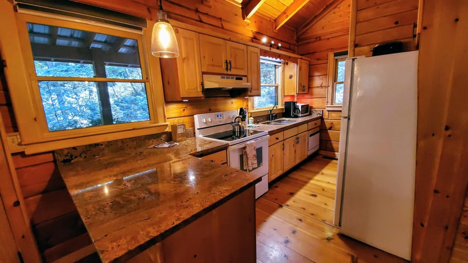 kitchen with granite countertops and new appliances