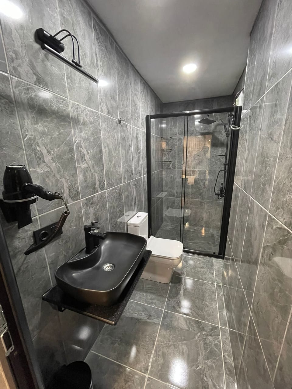 Shower, hydromassage showerhead, designer toiletries, hair dryer