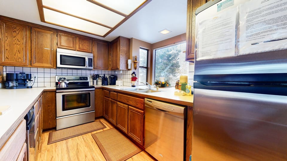 Condo, 2 Bedrooms | Private kitchen | Full-size fridge, microwave, oven, stovetop