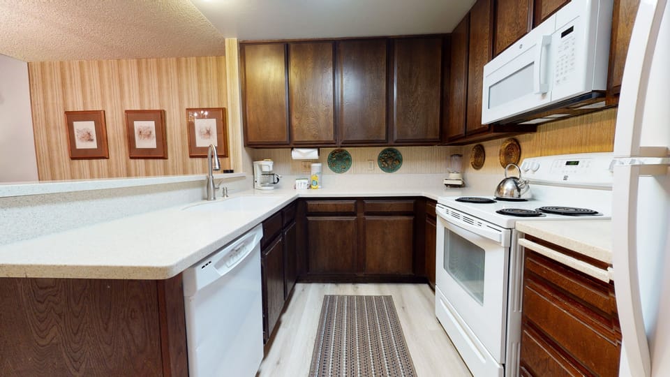 Condo, 2 Bedrooms | Private kitchen | Full-size fridge, microwave, oven, stovetop