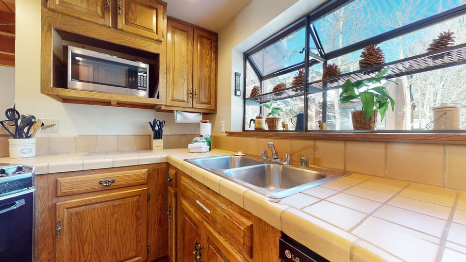 Condo, 2 Bedrooms | Private kitchen | Full-size fridge, microwave, oven, stovetop