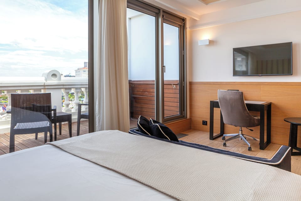 Double Room, 1 Queen Bed, Terrace, Beach View | Minibar, in-room safe, desk, laptop workspace