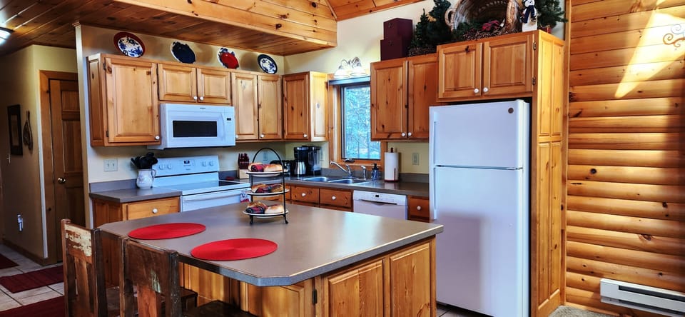 Fully equipped kitchen plus Weber charcoal and propane gas grills for cook outs.