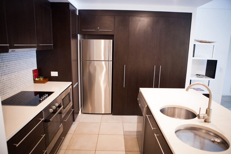Luxury Apartment, 2 Bedrooms, Pool View, Poolside | Private kitchen | Full-size fridge, microwave, oven, stovetop