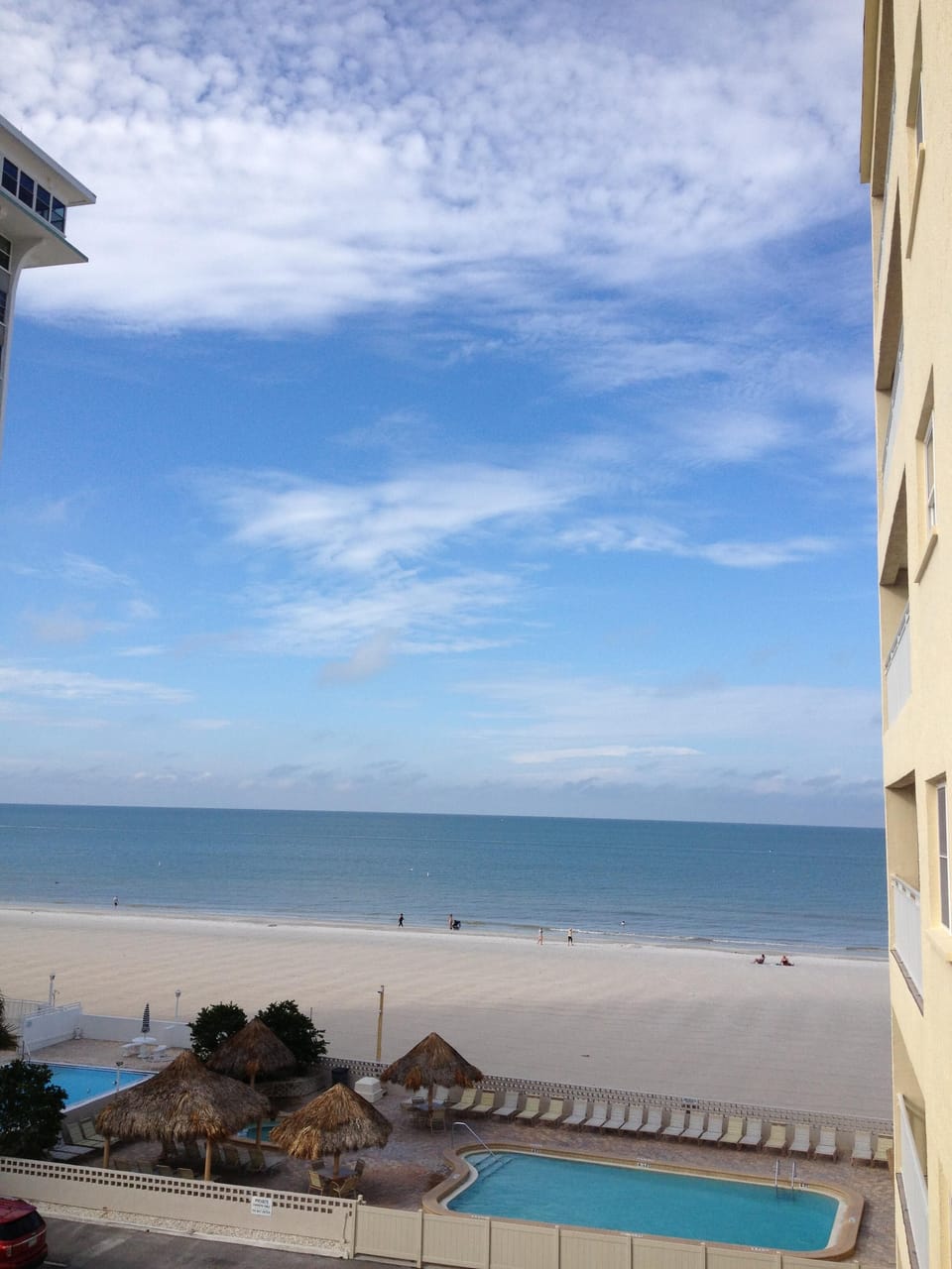 View from balcony of pool, Jacuzzi, beach, & Gulf