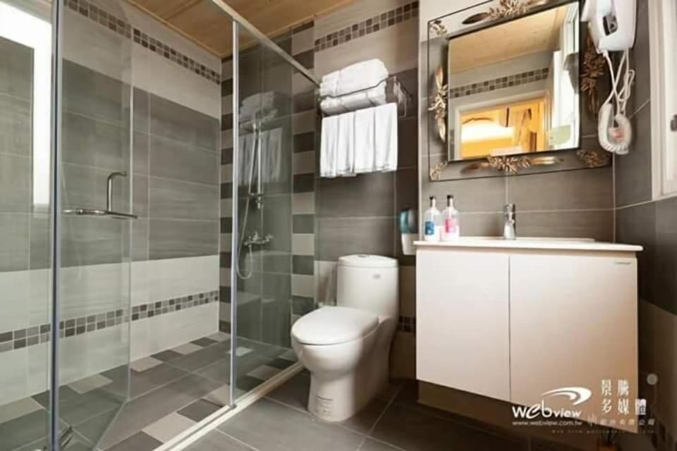 Shower, free toiletries, hair dryer, slippers