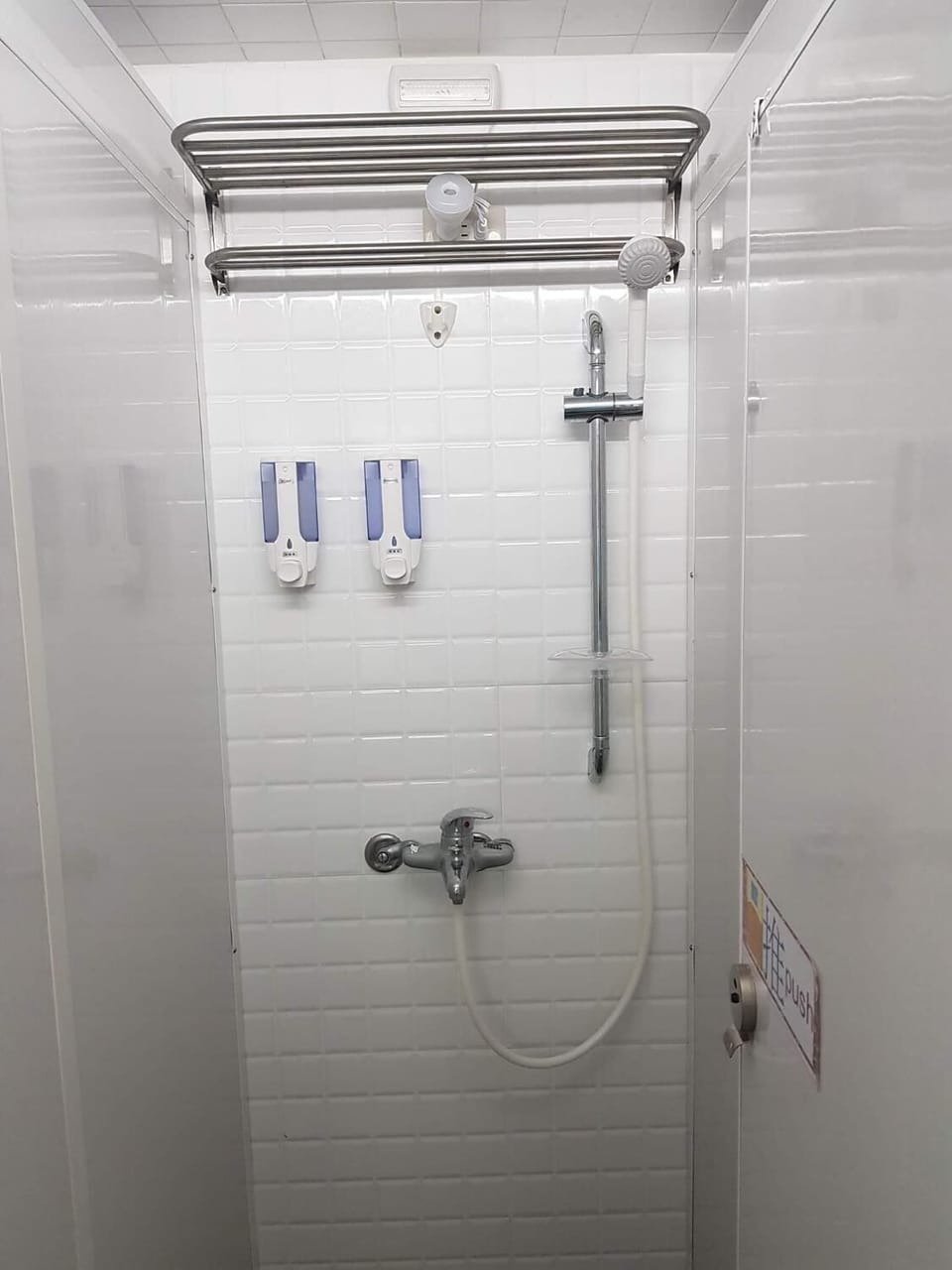 Shower, hair dryer, slippers, towels