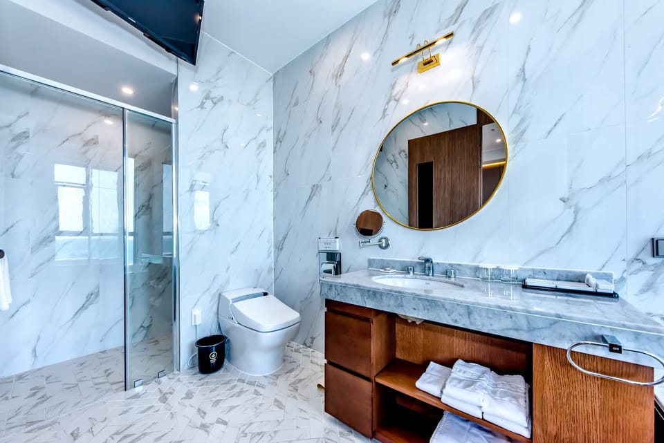 Designer toiletries, hair dryer, bathrobes, slippers