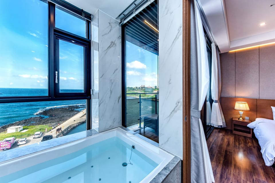 Designer toiletries, hair dryer, bathrobes, slippers