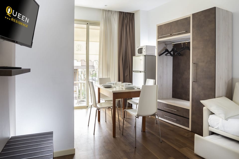 Apartment, 1 Bedroom, Balcony | Living room | Flat-screen TV