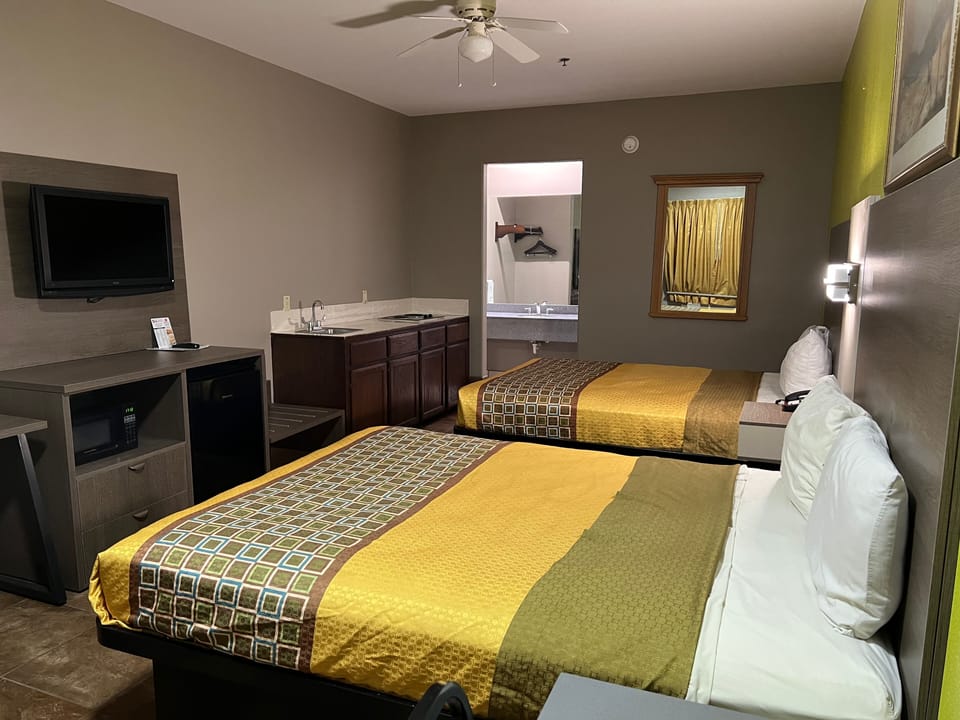 Deluxe Room, 2 Queen Beds, Non Smoking, Kitchenette | Desk, laptop workspace, blackout drapes, WiFi (free)
