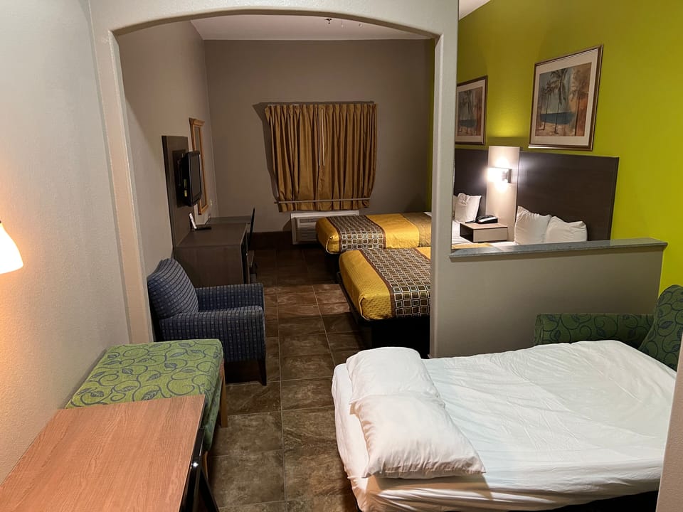 Deluxe Room, Multiple Beds, Non Smoking | Desk, laptop workspace, blackout drapes, WiFi (free)
