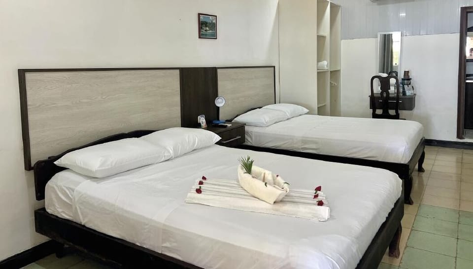 Panoramic Quadruple Room, 2 Queen Beds | 8 bedrooms, blackout drapes, free WiFi, bed sheets