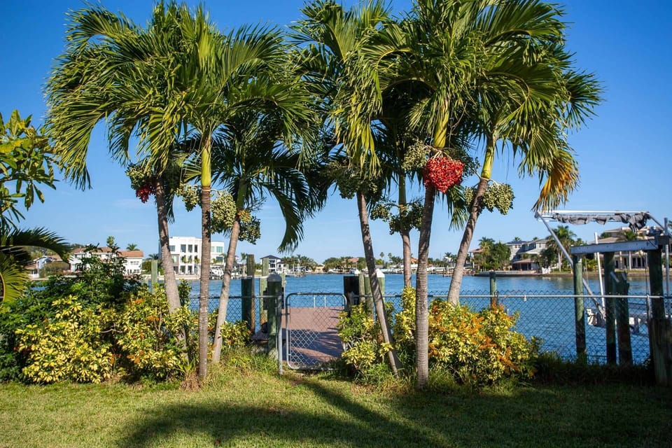 a private deep water dock for your boat, and plenty of space for parking cars or a trailer in the back yard