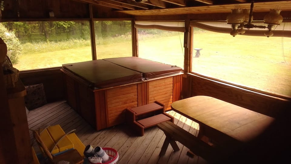 Hot tub on enclosed back porch
