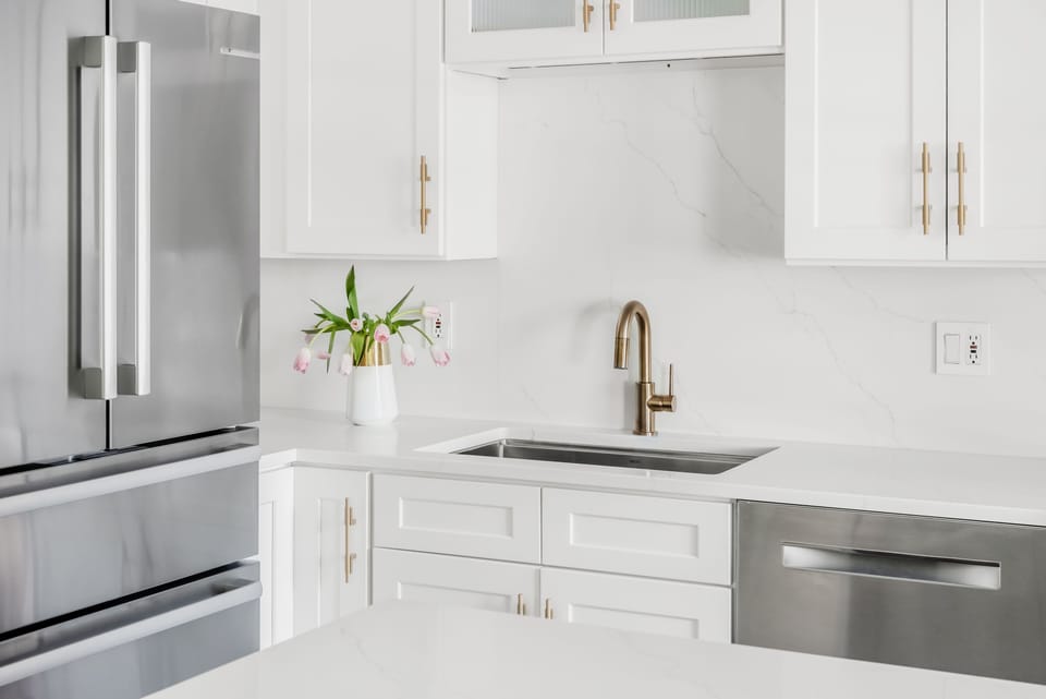 Custom kitchen with quartz counters and backsplash