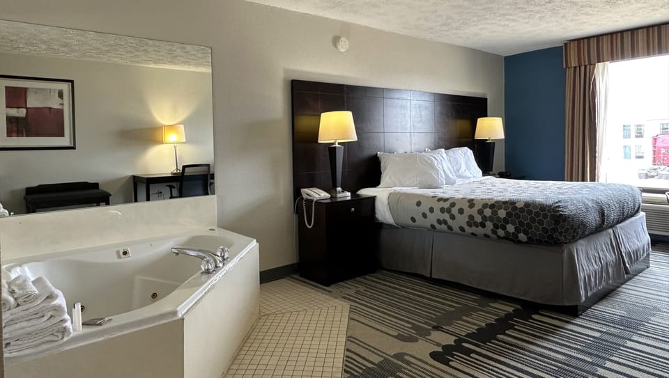 Room, 1 King Bed, Non Smoking, Jetted Tub | Desk, iron/ironing board, free WiFi, bed sheets