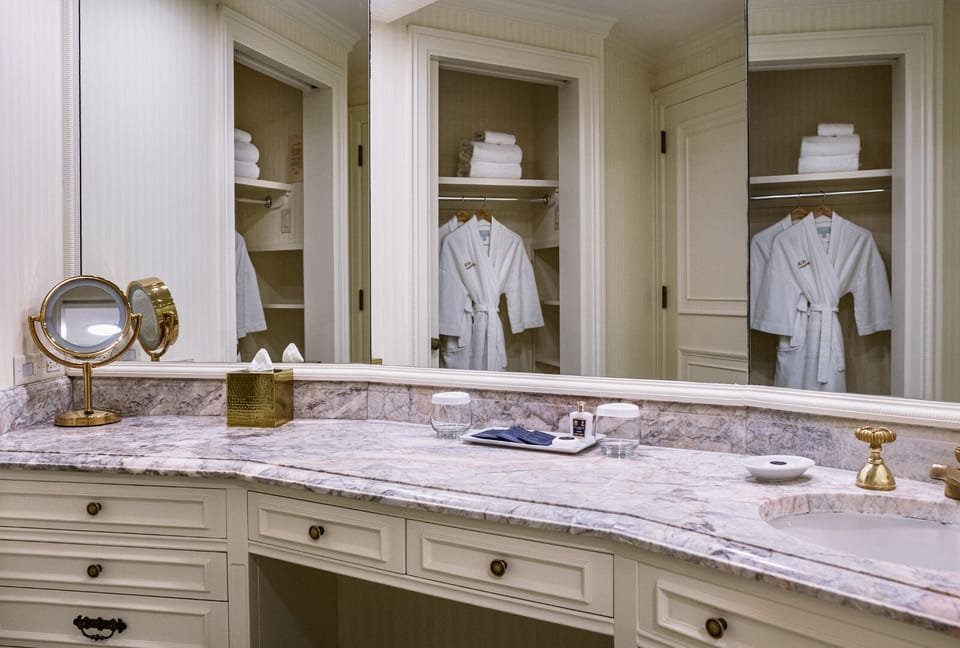 Combined shower/tub, designer toiletries, hair dryer, bathrobes