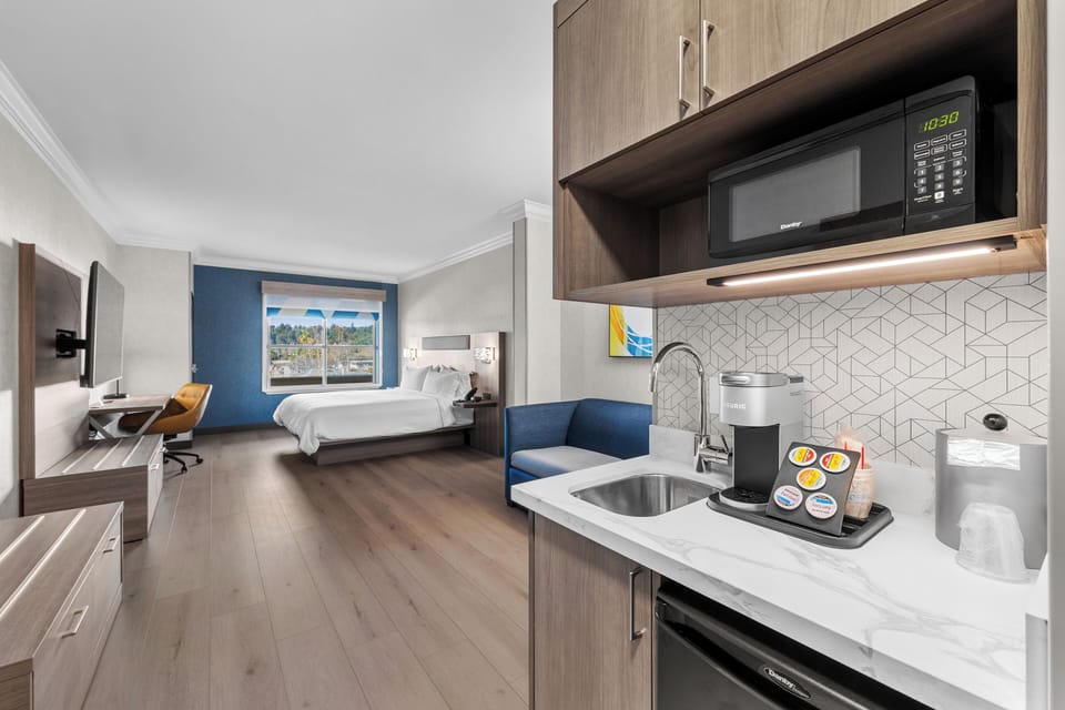 Suite, 1 King Bed | Desk, blackout drapes, iron/ironing board, cribs/infant beds