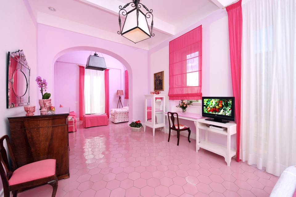 Suite | Living area | 18-inch TV with satellite channels, DVD player, pay movies