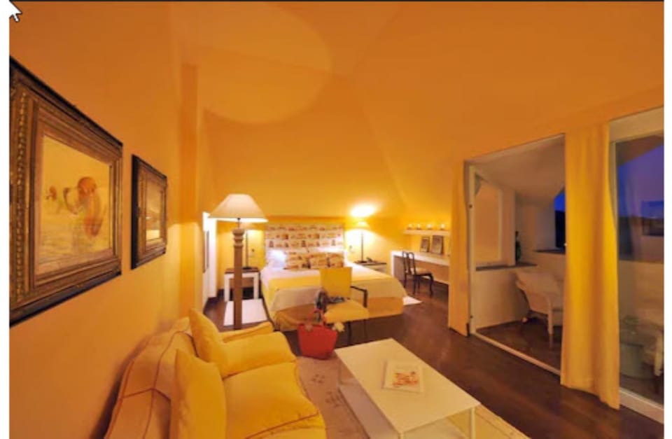 Suite | Living room | 18-inch TV with satellite channels, DVD player, pay movies
