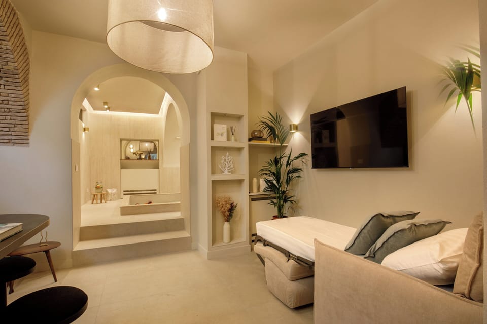 Superior Apartment with Sauna - Via della Croce 14 | Living area | Flat-screen TV