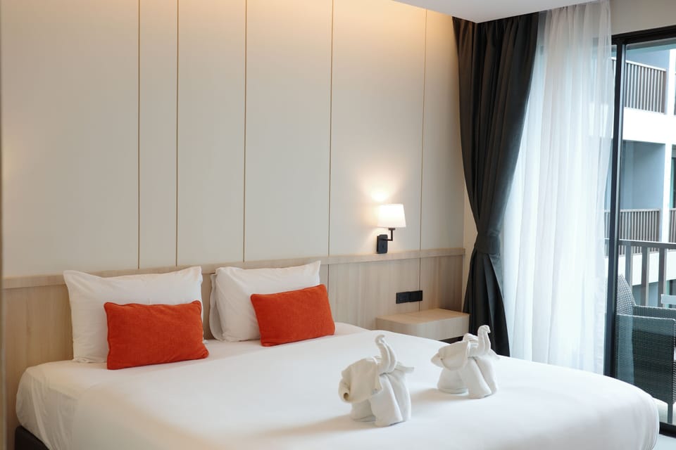 Deluxe Room, Pool View | Premium bedding, minibar, in-room safe, desk