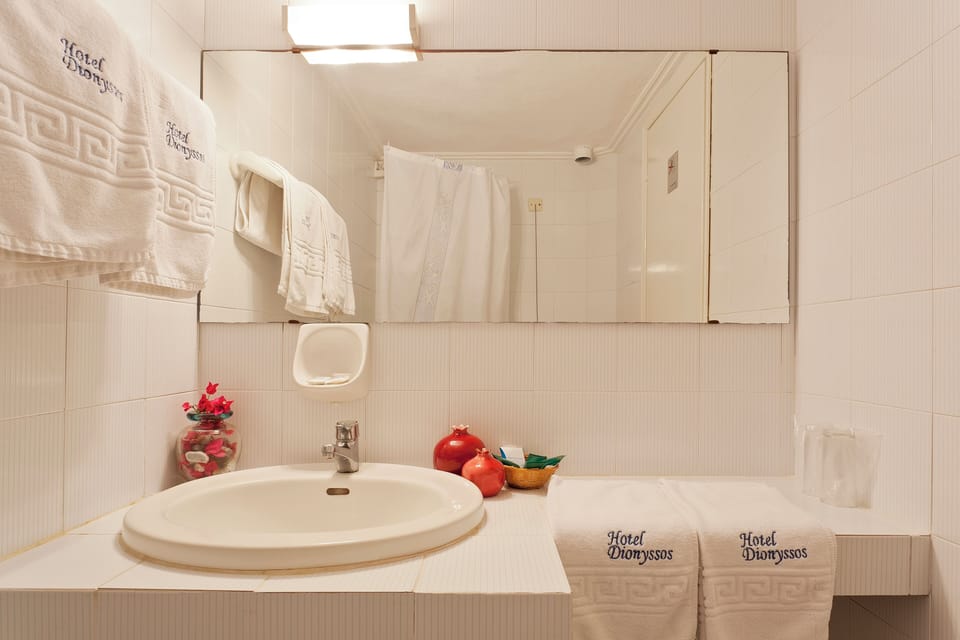 Shower, rainfall showerhead, hair dryer, towels