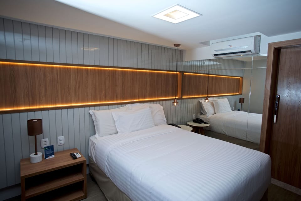 Economy Double or Twin Room | Minibar, in-room safe, blackout drapes, soundproofing