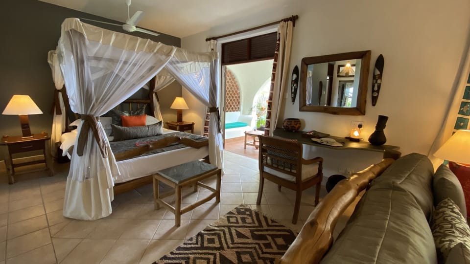 Grand Ocean Front Suite | Minibar, in-room safe, desk, iron/ironing board