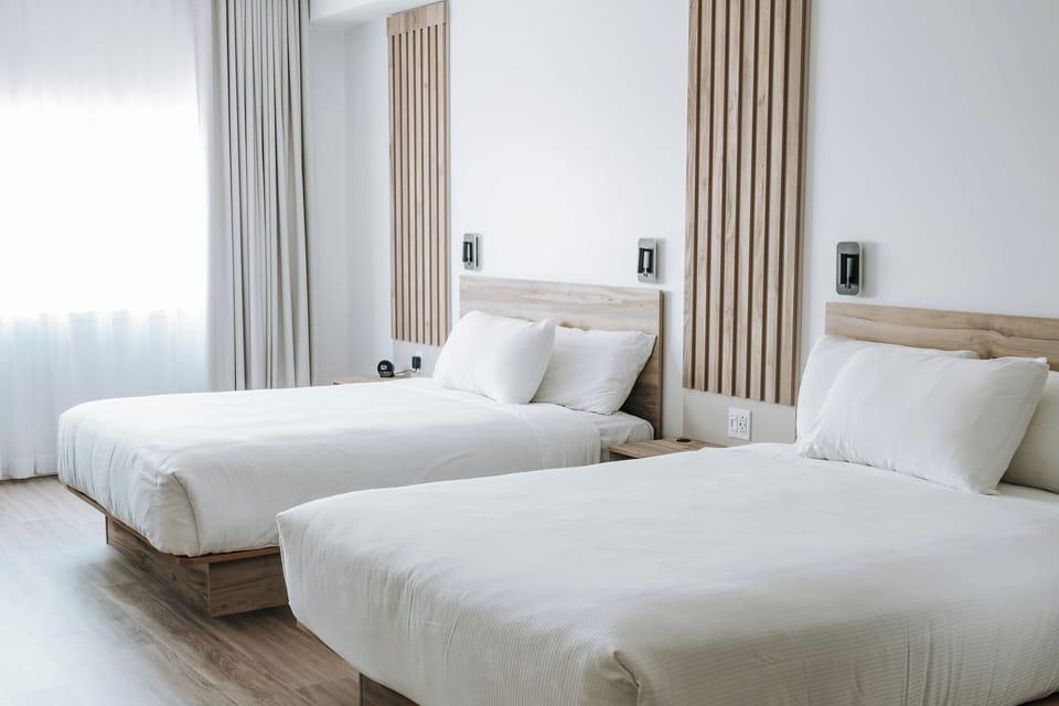 Deluxe Room, 2 Queen Beds | Premium bedding, in-room safe, desk, laptop workspace
