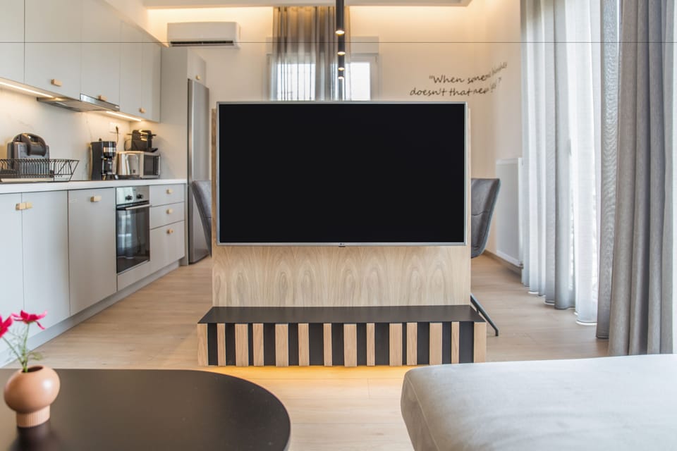Deluxe Apartment, 4 Bedrooms, Terrace, City View | Living area | Flat-screen TV, Netflix