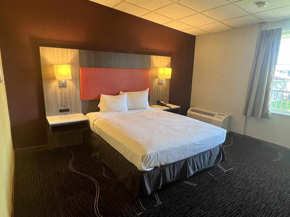 In-room safe, laptop workspace, blackout drapes, soundproofing