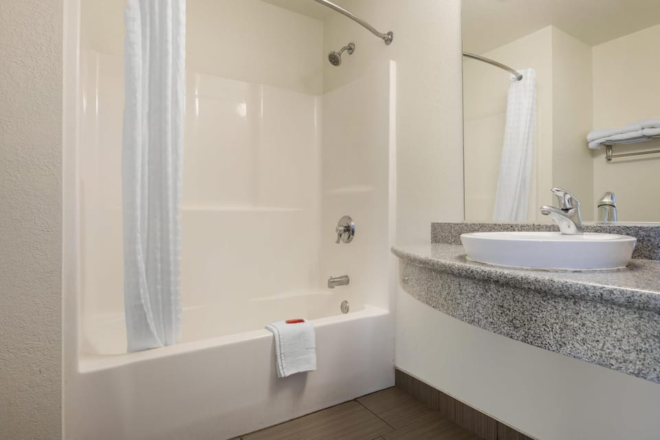 Standard Room, 2 Queen Beds, Non Smoking, Refrigerator & Microwave | Bathroom | Combined shower/tub, hair dryer, towels, soap