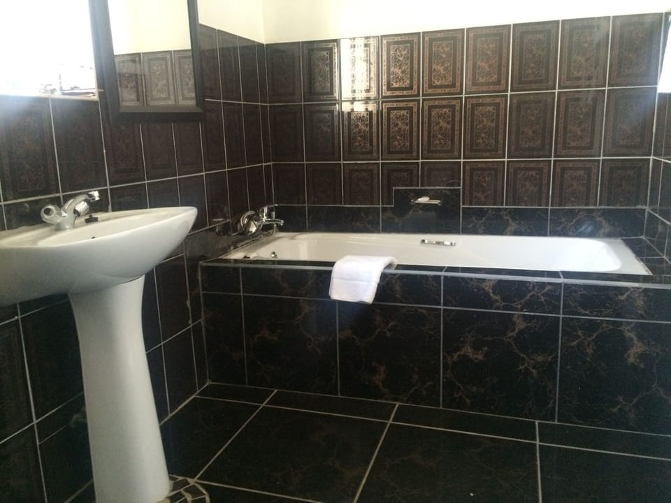 Deep soaking tub, rainfall showerhead, free toiletries, towels