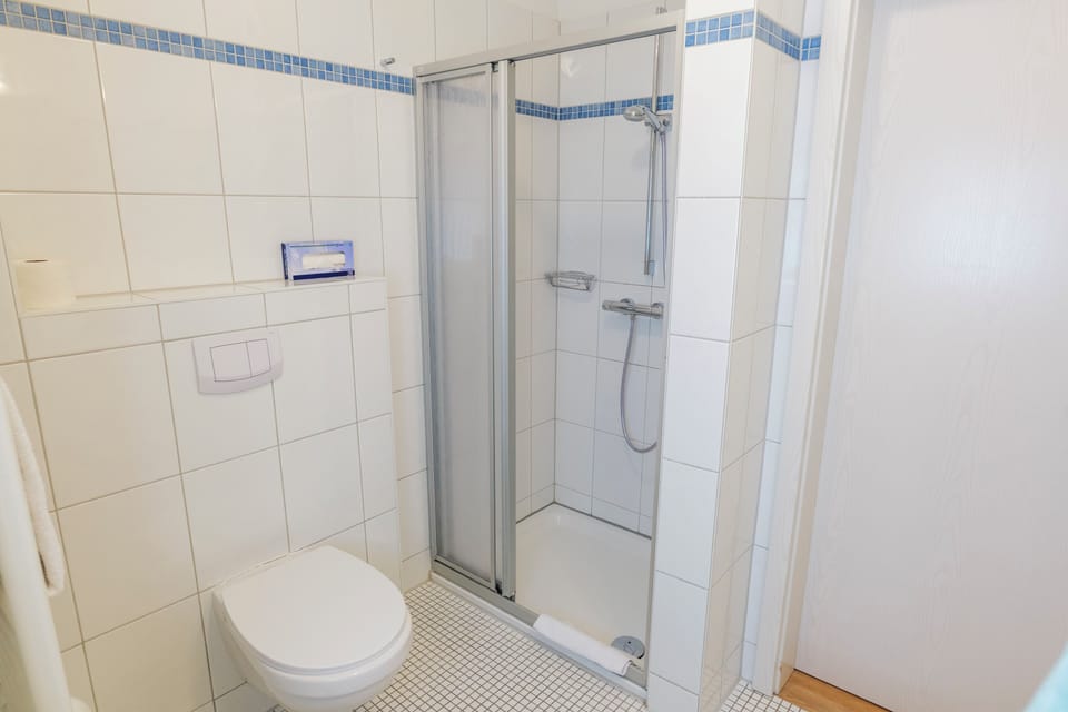 Apartment, 2 Bedrooms | Bathroom | Shower, free toiletries, hair dryer, towels