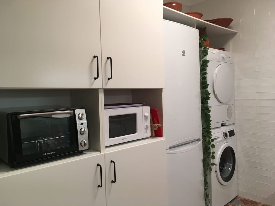 oven, microwave, washing machine, dryer, medicine cabinet and fire extinguisher 