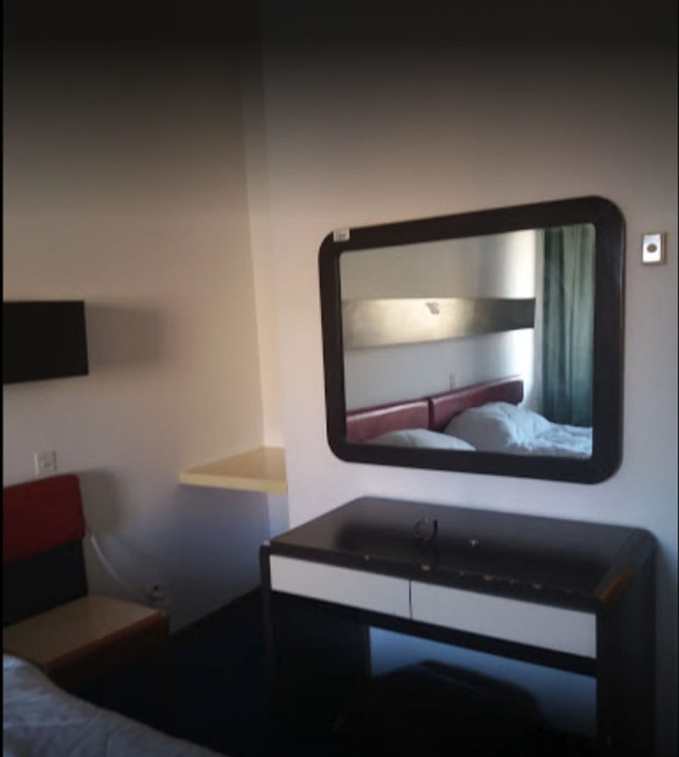 Desk, blackout drapes, WiFi (free), bed sheets
