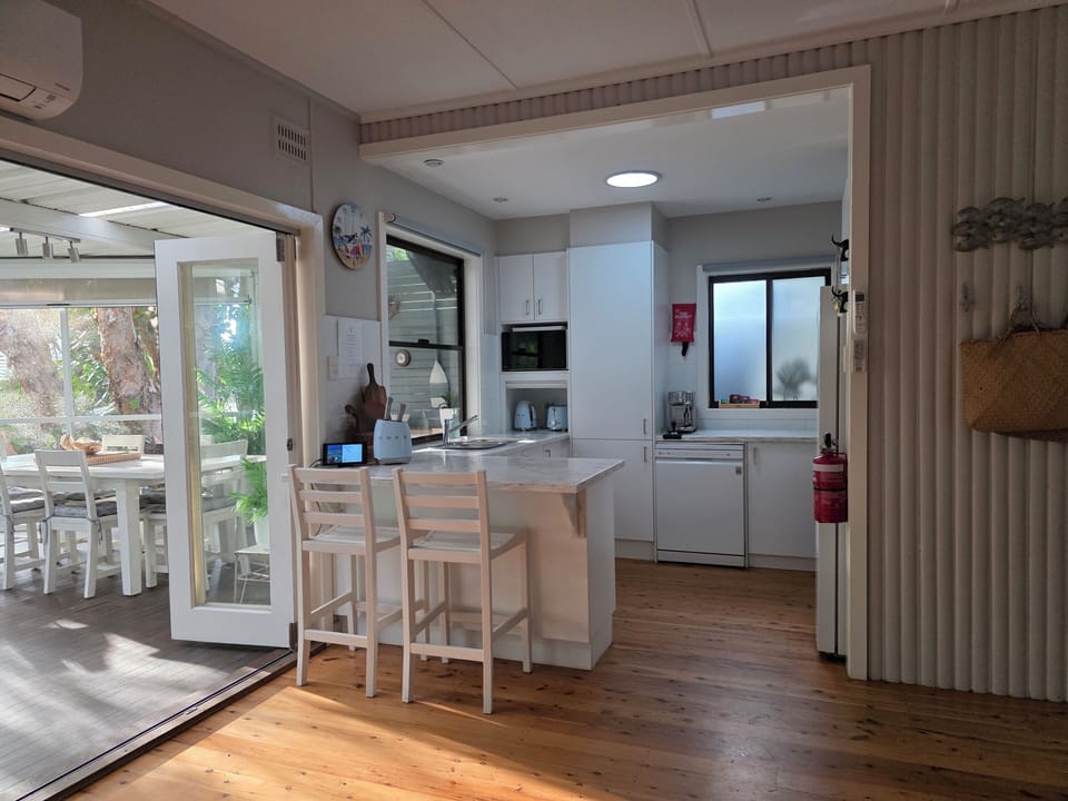 Kitchen from living to screened al fresco